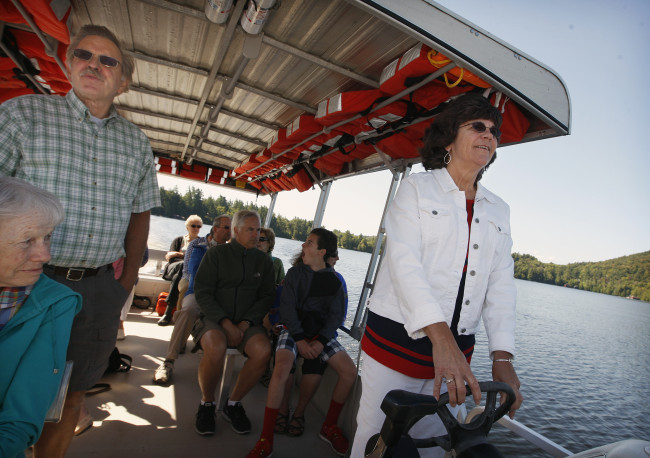 Going to and from Chapel Island on the Chapel Bound, 2014. All who attend Island Chapel arrive by boat, including many on the chapel-owned Chapel Bound, a pontoon boat that departs from Indian Carry.