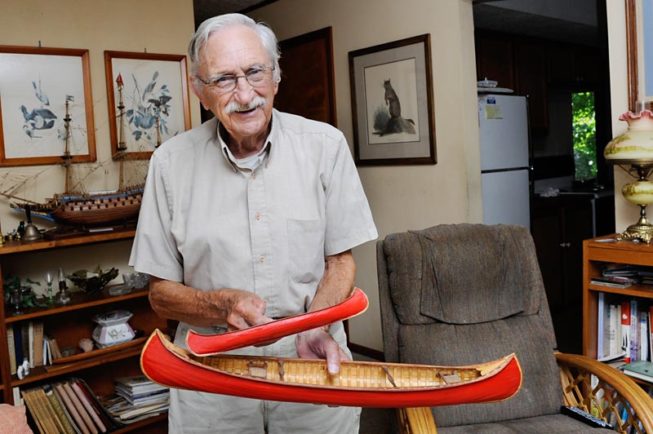Frank White shows one of his model boats, 2012.