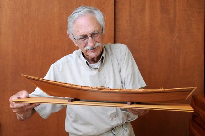 Frank White shows one of his model boats, 2012.