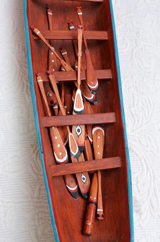 Model wooden boat interior with paddles by Frank White, 2012.