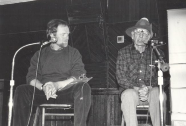 Ham Ferry (right) tells stories at an event with folklorist Robert Bethke (left). Date and photographer unknown.