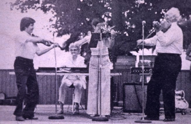 Newspaper clipping of the Perkins Family Band at a past performance. Date and photographer unknown.
