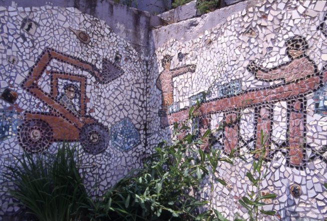 Mosaic mural detail showing the process of cutting and moving ice blocks from Lake Flower to use in building the ice palace, 1997.